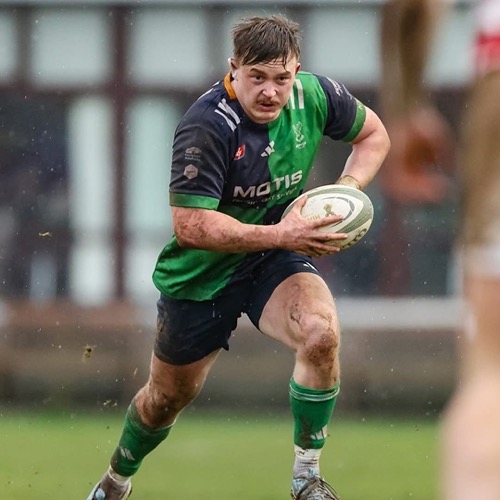 Josh Hanlon playing rugby