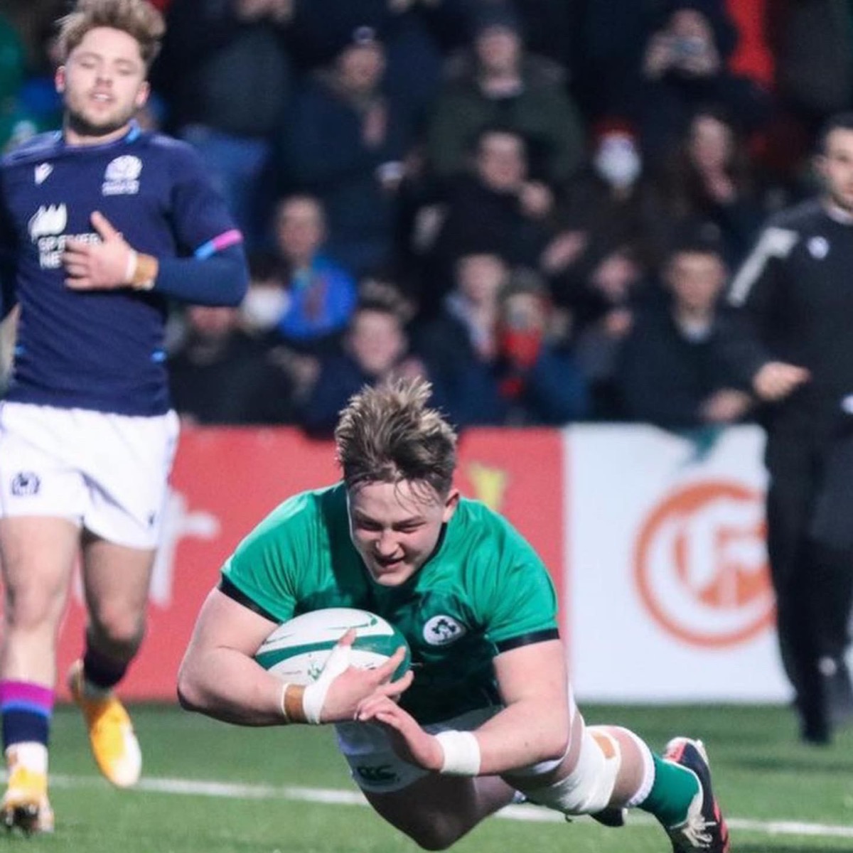 Josh Hanlon playing rugby